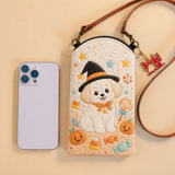 Pochette matelassée pour téléphone – Chiot avec chapeau de sorcière et bonbons
